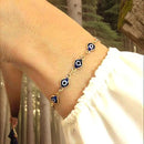 Pulseira feminina banhada a ouro 18K com olhos gregos azuis